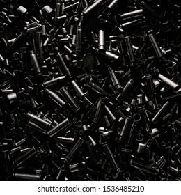 Different size bullet shells on the black ground. War concept. production of ammunition at the factory. brass bullet shell, ammunition manufacturing process