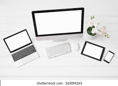 Different sized screens of desktop and laptop computers, tablet and phone