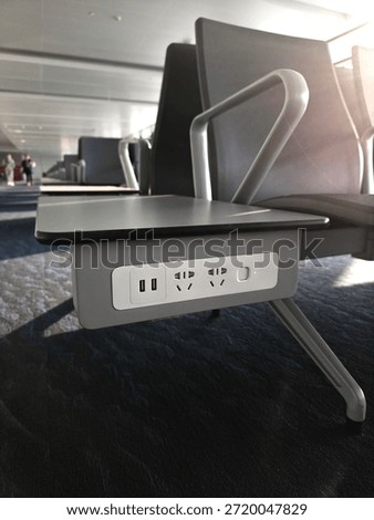 different socket tipes in empty waiting area near gate in terminal at airport