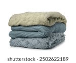 Different soft folded blankets on white background