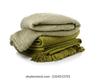 Different soft folded blankets on white background