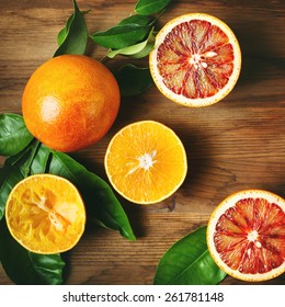 Different Sort Of Orange Fruit On Wooden Table. Top View. Instagram Color Effect.