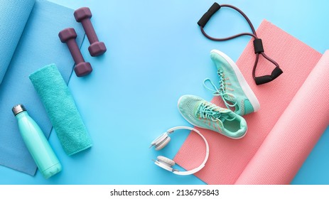 Different sports equipment, shoes and headphones on color background - Powered by Shutterstock