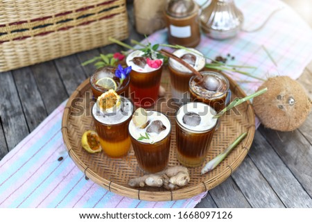 Different of summer drink - seven glass (iced black coffee mix Rice milk, Rose tea, Lemongrass Tea, Coconut water, Honey Lemon, Ginger juice, and passion fruit Is the perfect combination.