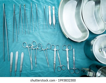 Different surgical instruments lying on the surgical table. Steel medical instruments ready to be used.
