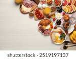 Different tasty food served for brunch on white wooden table, flat lay. Space for text