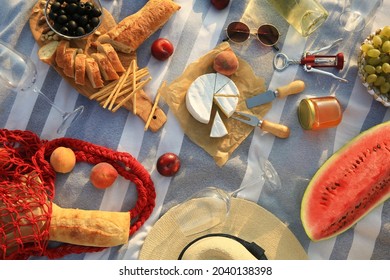 Different Tasty Snacks On Picnic Blanket, Flat Lay