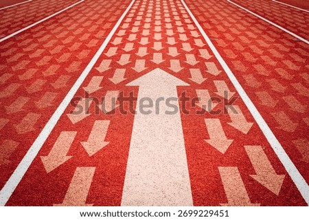 Different thinking concepts and changes in direction. Big arrow opposite direction with many small white arrows  on the running track.