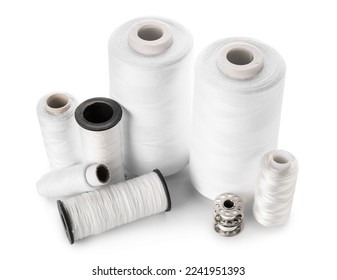 Different thread spools isolated on white background