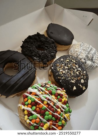 Different type of donuts chocolate and bunty