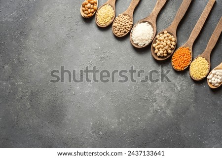 Different type of raw dry legumes composition. White beans, lentils, bulgur, chickpeas, kidney beans, rice,  Mix organic legume concept
