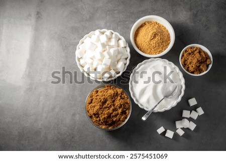  Different type of sugar. Light brown, dark brown and white sugar cubes in bowls.