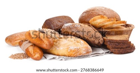 Different types of bread, grains and spikes isolated on white
