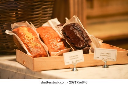 Different Types Of Bread Like Pastry Handmade Cakes In The Window Of A Bakery Store. Delicious Image For Food Lovers.