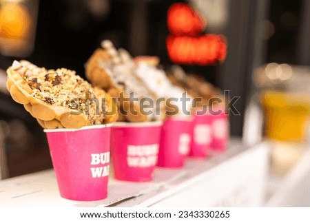 Different types of bubble waffle ice cream to go.