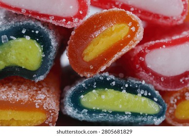 Different types of candy pieces are stacked together.