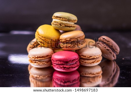 Different types of colourful macaroons in close up, Sweet and colourful french macaroons.