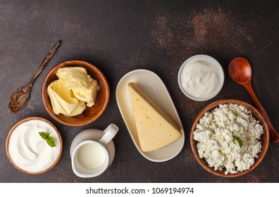 Different Types Of Dairy Products On Dark Background