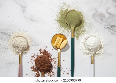 Different types of dietary supplements forhealth and beauty - collagen, vitamins, biotin, protein in pills and powder form - Shutterstock ID 2180903799