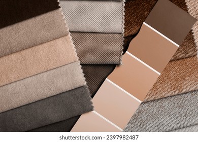 different types of fabrics with a color palette. New trending PANTONE 13-1023 Peach Fuzz colour of 2024 year - Powered by Shutterstock