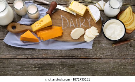 Different types of fresh dairy products on wooden background. Top view - Shutterstock ID 1871735131