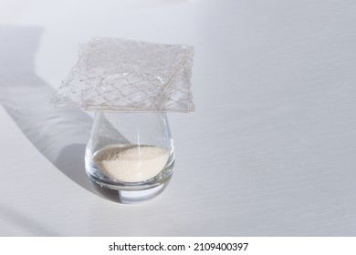 Different Types Of Gelatin Powder And Sheets On White Table.