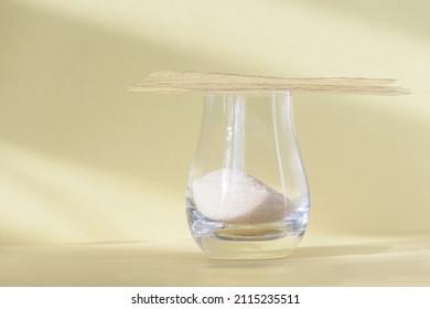 Different Types Of Gelatin Powder And Sheets On White Table.