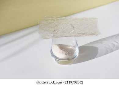 Different Types Of Gelatin Powder And Sheets On White Table.