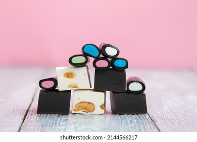 Different Types Of Licorice Sweets On A Wooden Background