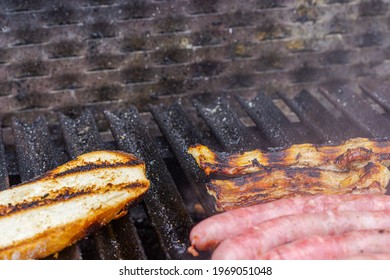 Different types of meat cooked on barbecue and toast