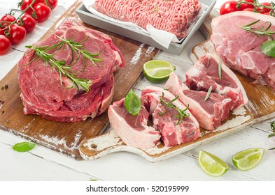 Different Types Of Meat With Fresh Herbs.