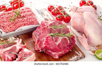 Different Types Of Meat With Fresh Herbs. Top View