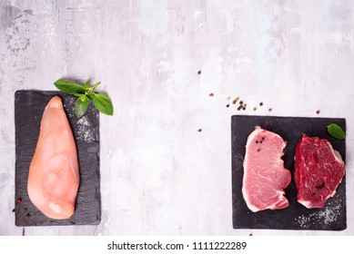 Different Types Of Meat On Dark Slate Cutting Board. Lean Proteins.