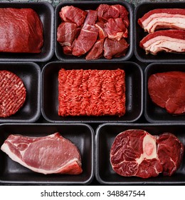 Different types of meat in plastic boxes packaging tray - Shutterstock ID 348847544