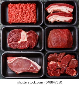 Different types of meat in plastic boxes packaging tray