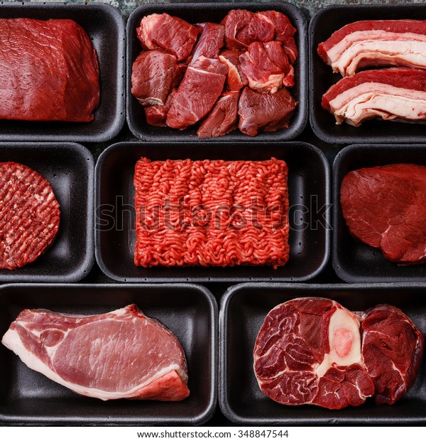 Different\
types of meat in plastic boxes packaging\
tray
