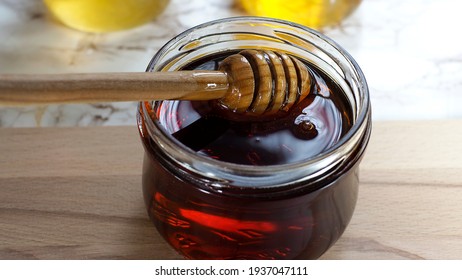 different types of natural honey in glass jars