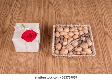 Different types of nuts in basket on wooden background