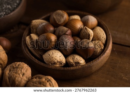Different types of nuts in the nutshell. Hazelnuts, almonds