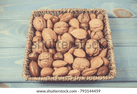 Similar – Image, Stock Photo Wooden background with almonds and chia seeds