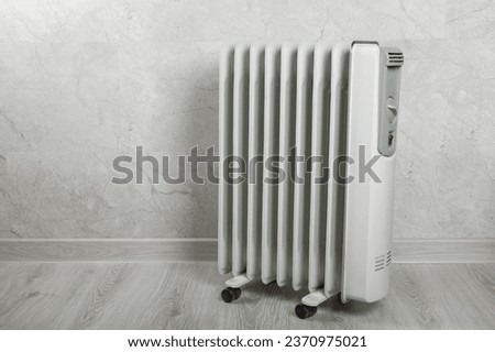Different types of radiators. Heating systems store.Modern radiator at home. Central heating system. radiator, White radiator in the apartment.Expensive heating costs concept, close-up.Heating season.