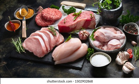 Different Types Of Raw Meat On Black Background. 