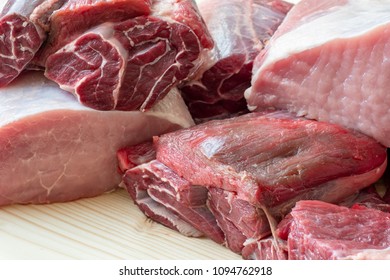 Different Types Of Raw Pork Meat And Beef. Raw Meat On Wooden Table.