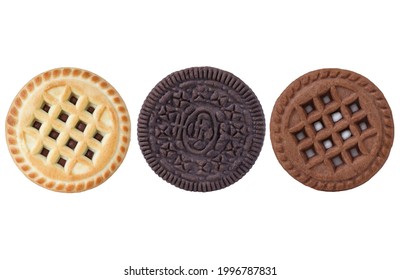 Different types of sandwich cookies on an isolated white background. Chocolate, vanilla cookies with filling
