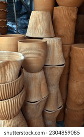 Different types and sizes of stacks clay pots(for planting) were on sale at the garden market.