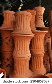Different types and sizes of stacks clay pots(for planting) were on sale at the garden market.