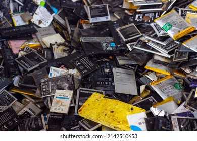 Different types and different sizes of used cell phone batteries for recycling. 23 March 2022 - Istanbul