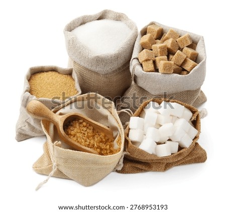 Different types of sugar in sacks isolated on white