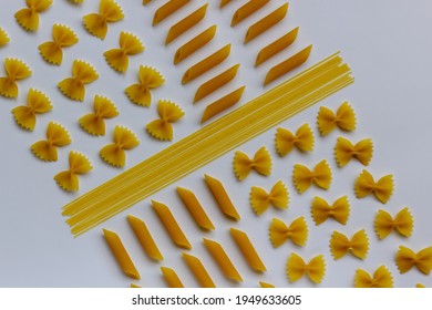 Different types of uncooked pasta on white background. Food knolling.  Food ingredients concept. Healthy lifestyle. Flat lay, copy space.
