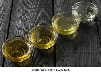 Different types of vegetable oil of vegetable mustard and sesame seed, walnut, grape seeds in glass bowls. It is used in dietary and healthy nutrition. Source of vitamins polyunsaturated fatty acids